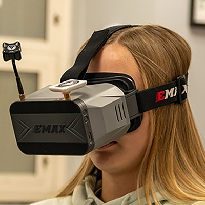 Girl with EMAX FPV Box Goggles on.